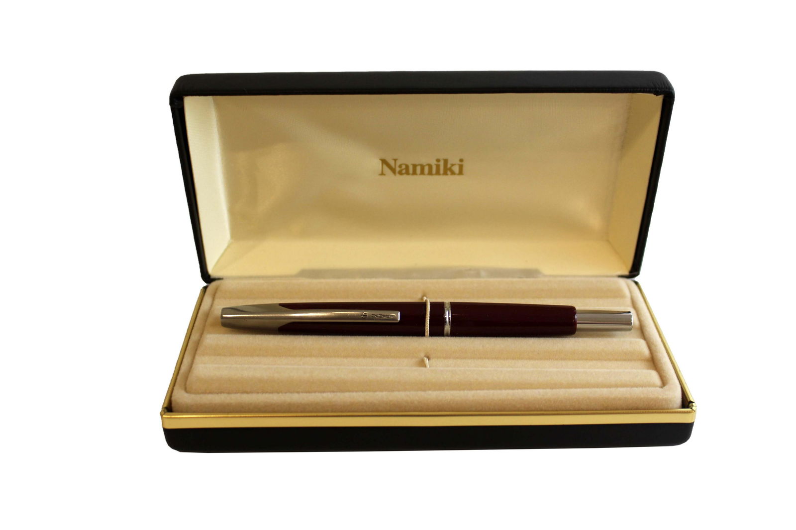 Namiki Fountain Pen Vanishing Point Burgundy: A classic vanishing point, retractable, fountain pen. Body of pen is burgundy with silver details. Hand made from solid sterling silver. From a private collection. In original box with paperwork. From