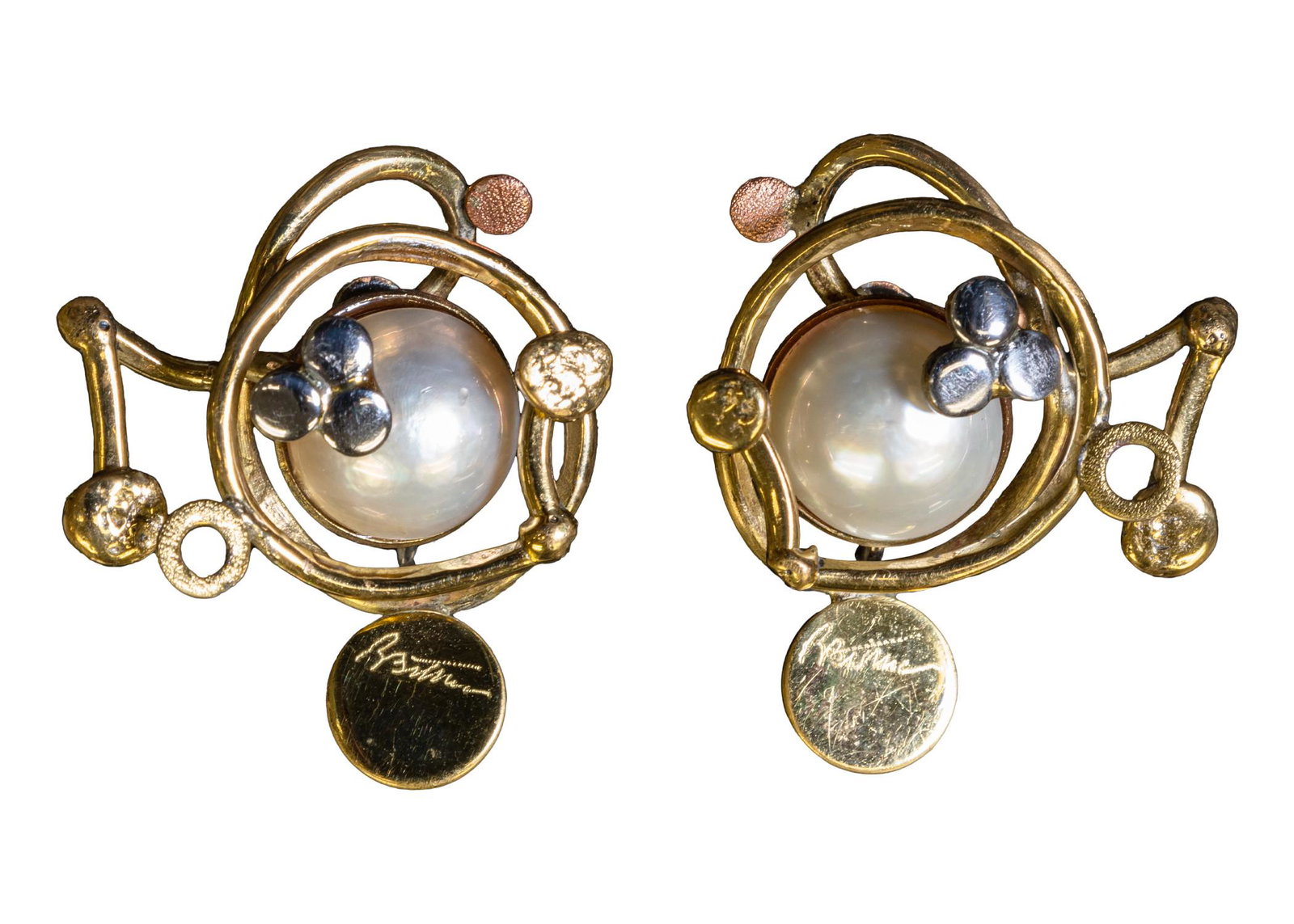 Richard Bitterman Modernism Pair of Earrings Swirled Metal with Mabe Pearl Fine Jewelry Design: A modernist pair of clip on earrings with a swirled metal and a mabe pearl-like inlay designed by Richard Bitterman. Engraved artist signature backings. Circa 1970s. An example of wearable art. Richar