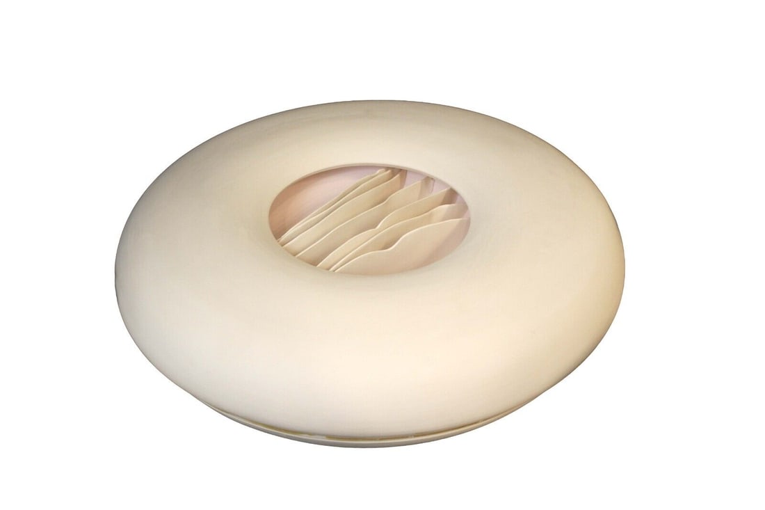 Joan Lurie Signed Porcelain Sculpture with Ribbon Design 1987: An elegant porcelain vessel sculpture by Joan Lurie. Signed on bottom with a 1987 date. The sculpture is a circular vessel with a waved ribbon design in the center. From a private collection. Dimensio