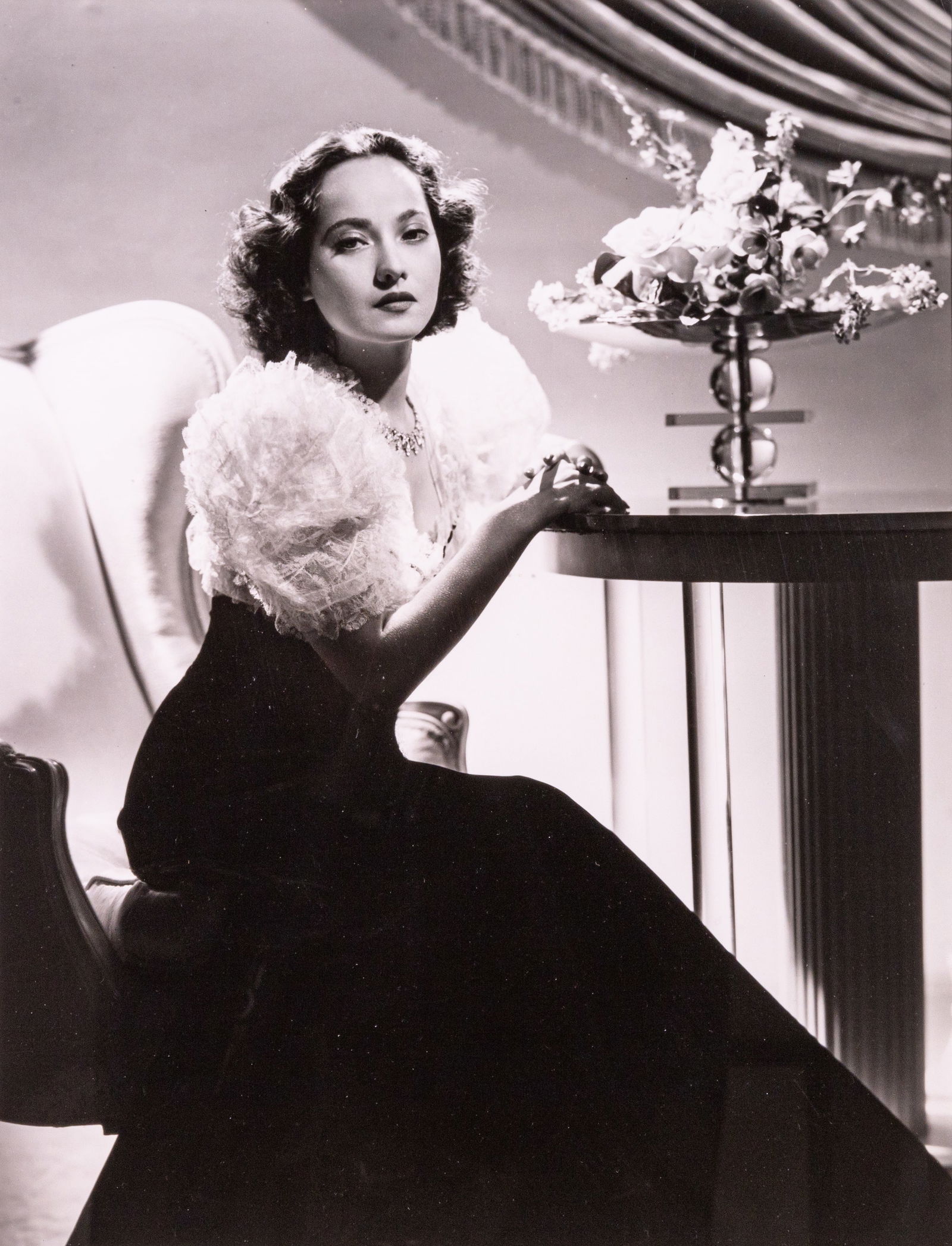 George Hurrell Portrait of Merle Oberon Vintage Gelatin Silver Print Warner Brothers Framed 1930s: A vintage gelatin silver print on paper depicting a portrait of Merle Oberon by photographer George Hurrell. Stamped Hurrell Warner Brothers copyright on verso. Circa 1930s. Oberon is portrayed sittin