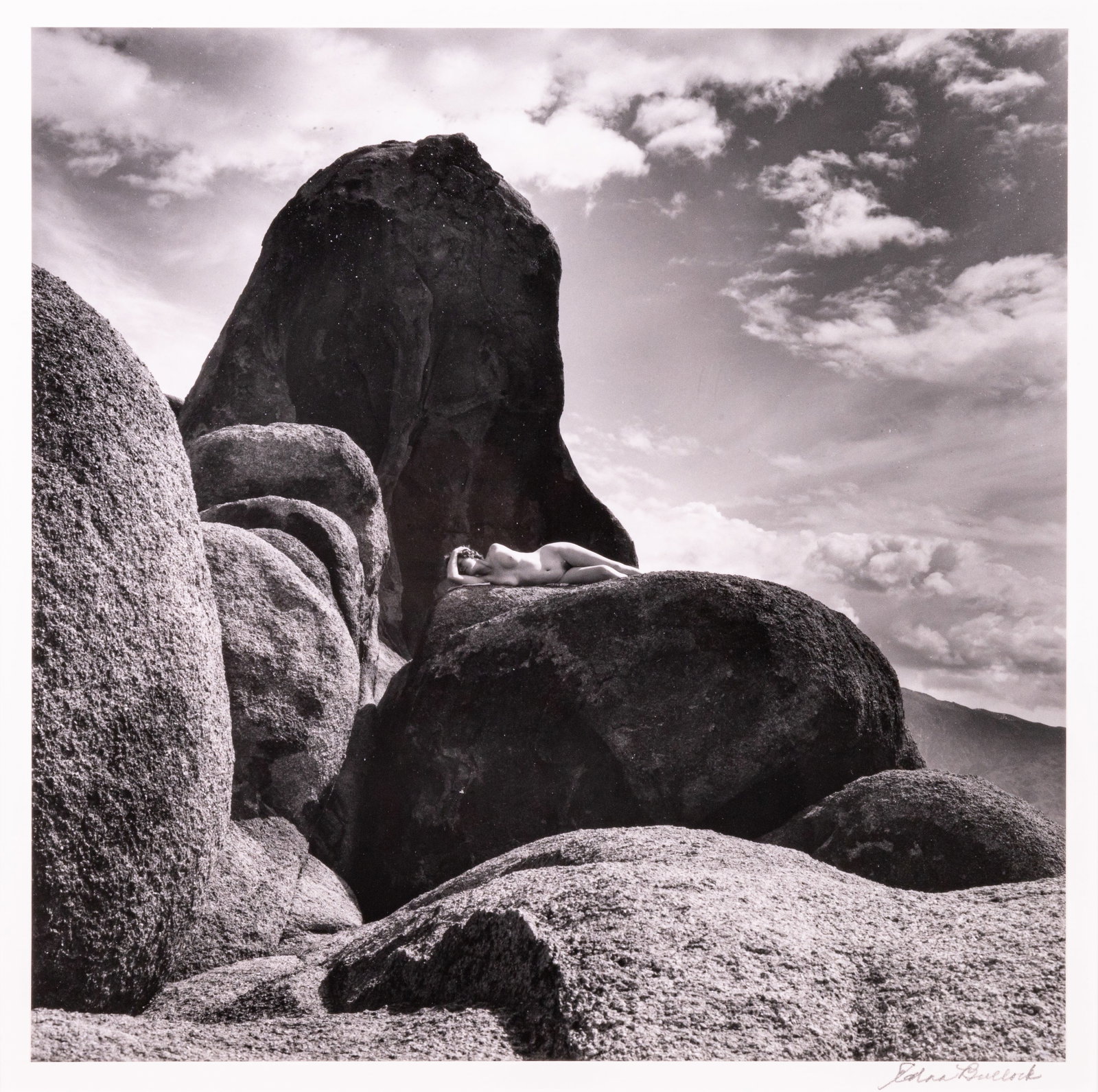Edna Bullock Signed Female Nude in Nature Contemporary Gelatin Silver Print Framed 1980s: A contemporary gelatin silver print on paper by photographer Edna Bullock. Hand signed in pencil bottom right corner. Circa 1980s. A female nude is laying outstretched on a monumental rock. Bullock of