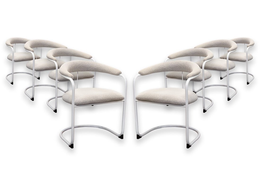 Anton Lorenz Set of 8 for Thonet White Tubular Cantilever SS33 Dining Armchairs: A set of SS33 cantilever dining chairs by Anton Lorenz for Thonet. This gorgeous set of mid century modern dining chairs features an iconic cantilever design. Timeless, yet simple, these chairs stand