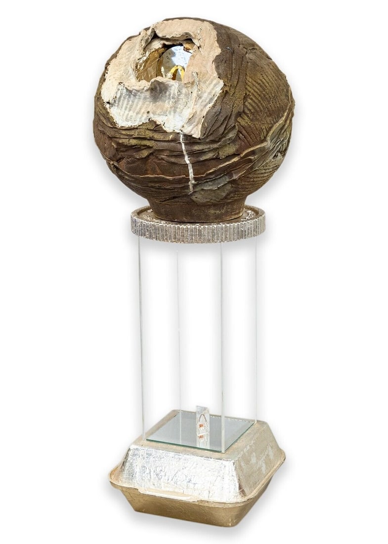 Noah Alonso McDonald's Golden Arches Contemporary Conceptual Sculpture 1990s: A contemporary conceptual sculpture that is a satirical celebration of McDonalds's by Michigan artist Noah Alonso. Circa 1990s. A golden take-out box becomes the base of a pedestal which suspends a cr