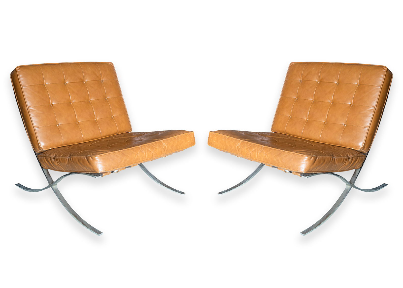 Supreme Industria Argentina Pair of Barcelona Chairs Cognac Brown Leather Chrome Modern Design 1970s: A vintage pair of Barcelona lounge chairs, manufactured by Supreme Industria Argentina dating to the early 1970s, officially licensed prior to Knoll holding the production license, featuring rich cogn
