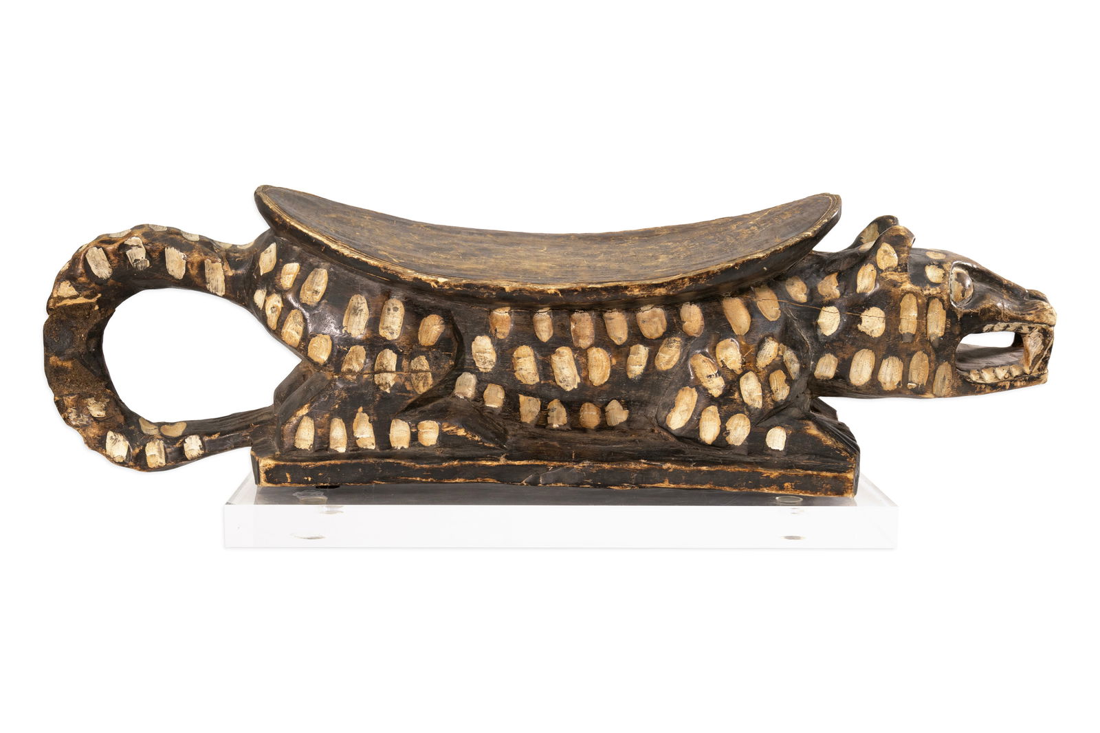 Yoruba West African Leopard Headrest 20th Century Hand-Carved Wood & Lucite: A hand-carved wooden headrest from the Yoruba people of West Africa, dating to the 20th century. Presented on a modern lucite display base. From a private collection. Dimensions: 10.75"h x 32.5"d x 10