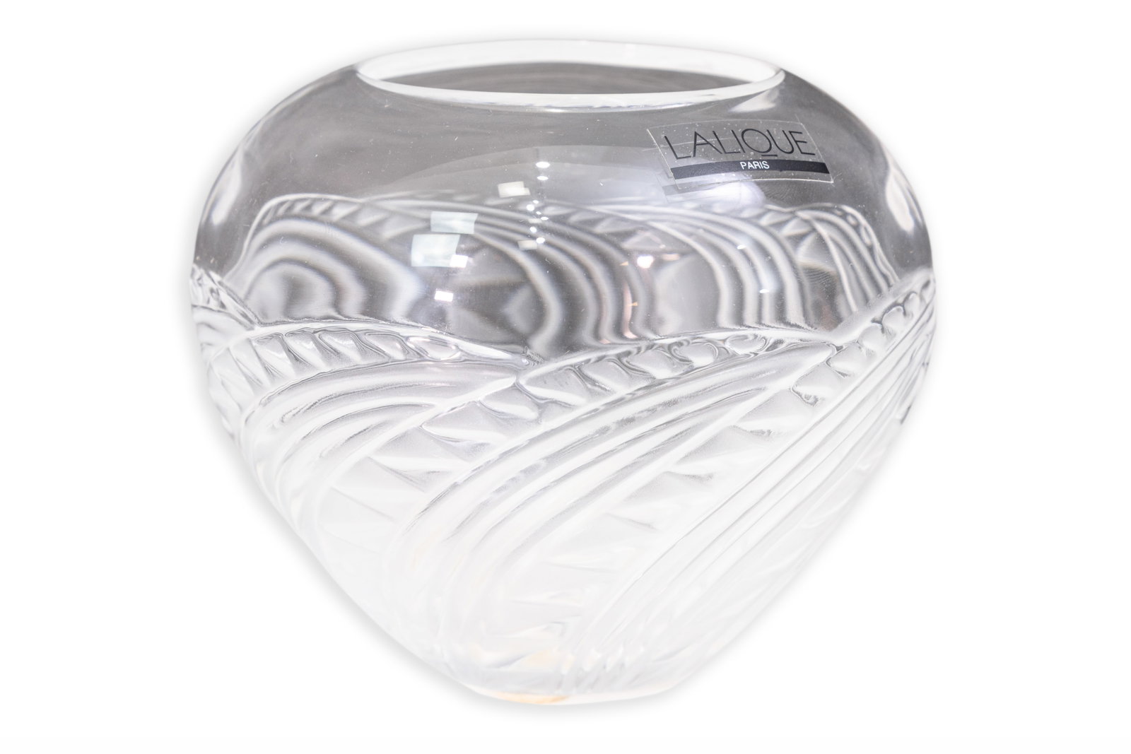 Lalique - Etched Leaf Motif Crystal Vase, France: A small clear crystal vase by Lalique, France, retaining its original Lalique Paris label. The rounded form features an etched and frosted relief design of overlapping stylized leaves. Alternating pol