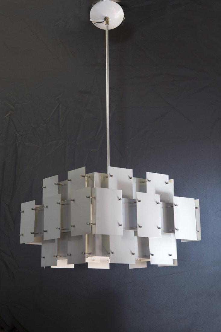 Robert Sonneman Cityscape Chrome Chandelier: Rare, large Robert Sonneman Cityscape hanging chandelier. This fixture is composed of a multitude of interconnected brushed steel panels centered around one giant light. This chandelier is in exce