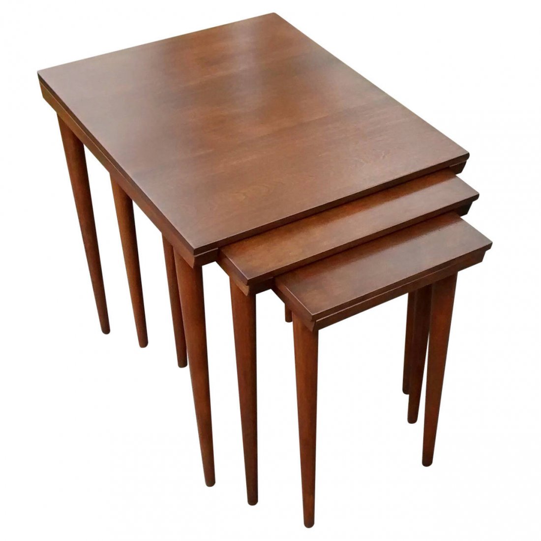 Russel Wright Conant Ball, Set of Three Nesting Tables: Russel Wright designed set of three nesting tables for Conant Ball Furniture Company, dating to the early 1950s. Rendered in solid hardrock maple, this nesting set is very dense and well made. Just re