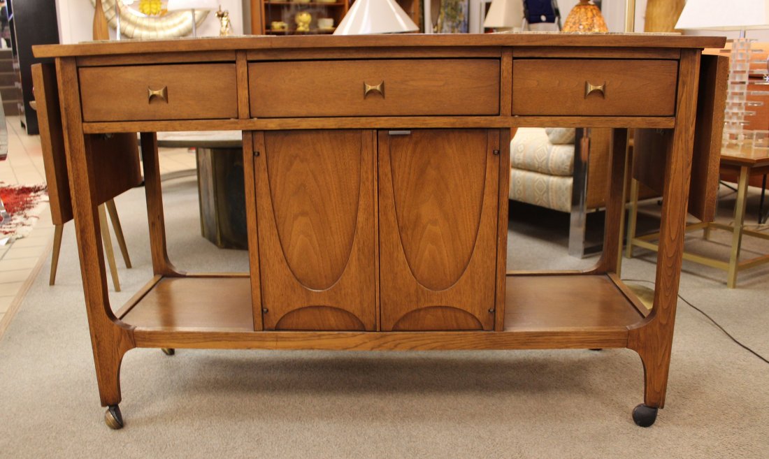 Broyhill Brasilia Bar Cart By Oscar Neimeyer: Broyhill Brasilia Bar Cart designed by Oscar Neimeyer with 2 drop leaf extensions and 2 tile trivets that can be changed to match decor. 47" W (80" When Expanded) x 16.25" D x 30" H.