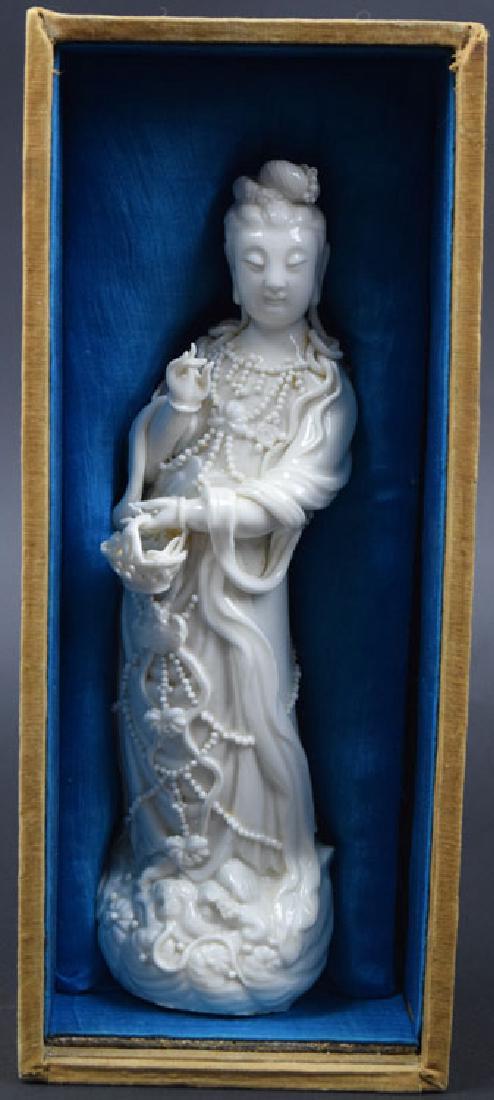 Chinese Qing Blanc De Chine Guanyin with original box: Chinese Qing Blanc De Chine Guanyin with original box, her one hand holding a basket, the other hand in Buddhist mudra. late 19th C. 10" H