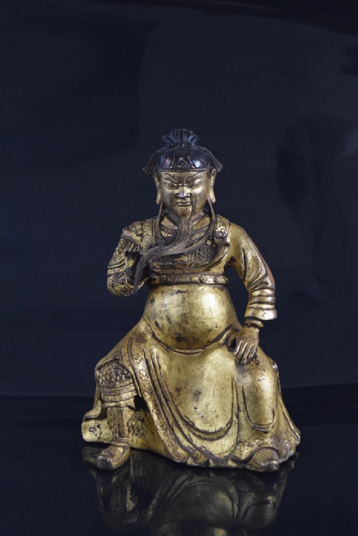 Chinese gold lacquered bronze Guandi: Chinese gold lacquered bronze Guandi, seating on a chair. 8 1/2"H x 5 3/4"W