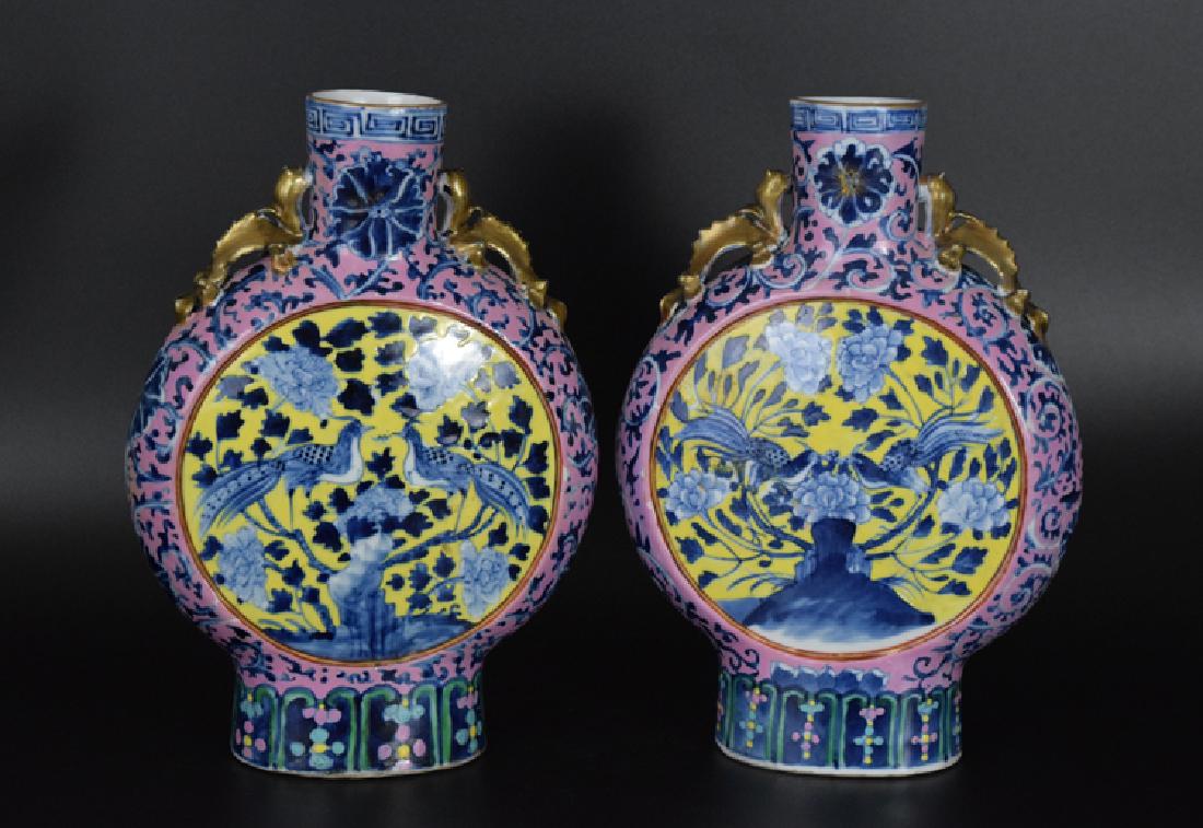 Pr. Chinese Qing Famille Jaune and cobalt blue: Pr. Chinese Qing Famille Jaune and cobalt blue porcelain moon flasks, depicting birds and peony blossoms. Circa 19th C. 10 1/4"H