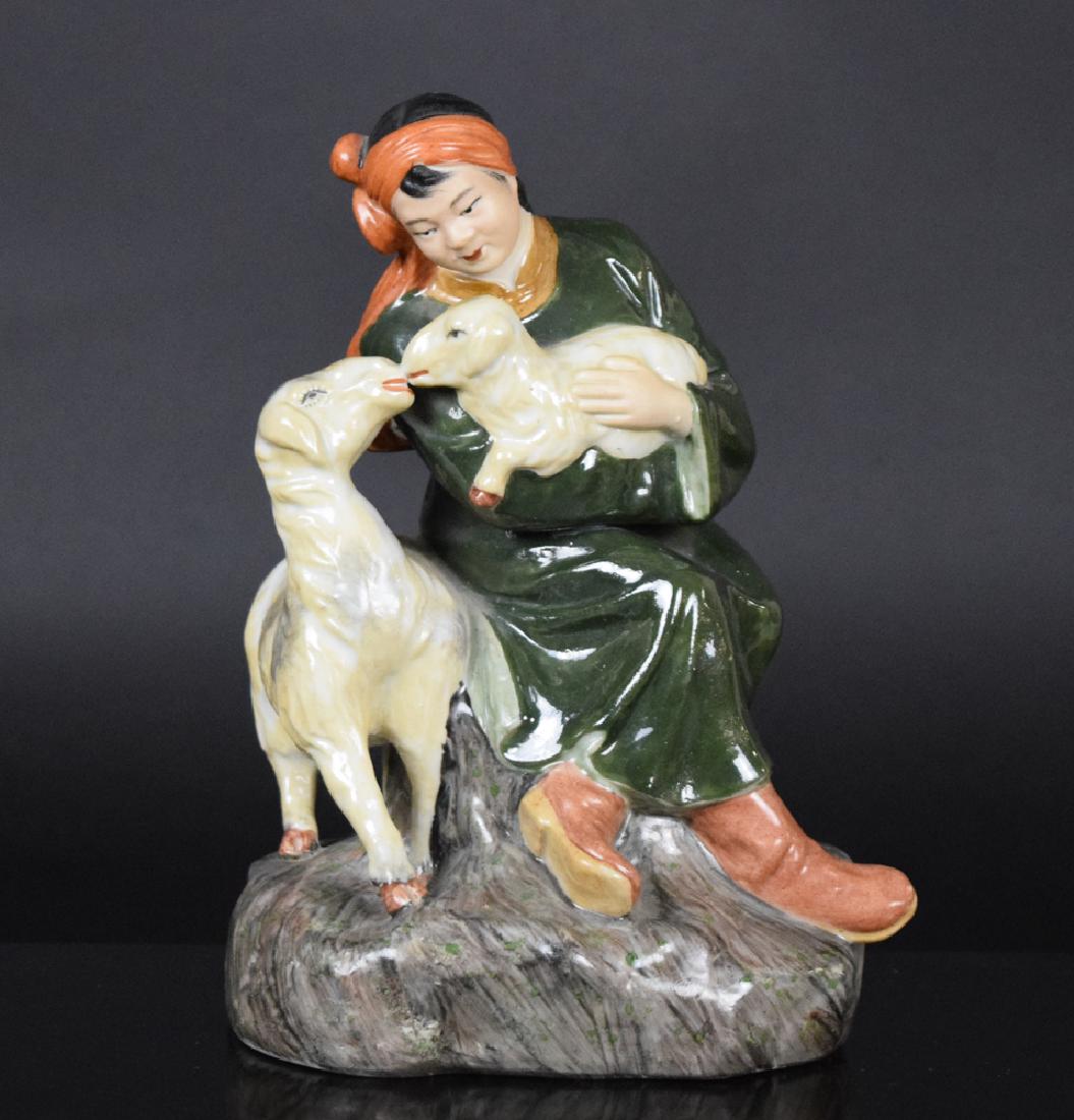 Chinese cultural revolution porcelain figure: Chinese cultural revolution porcelain figure, depicting a Mongolian girl with two lamb. Circa 1960"s.