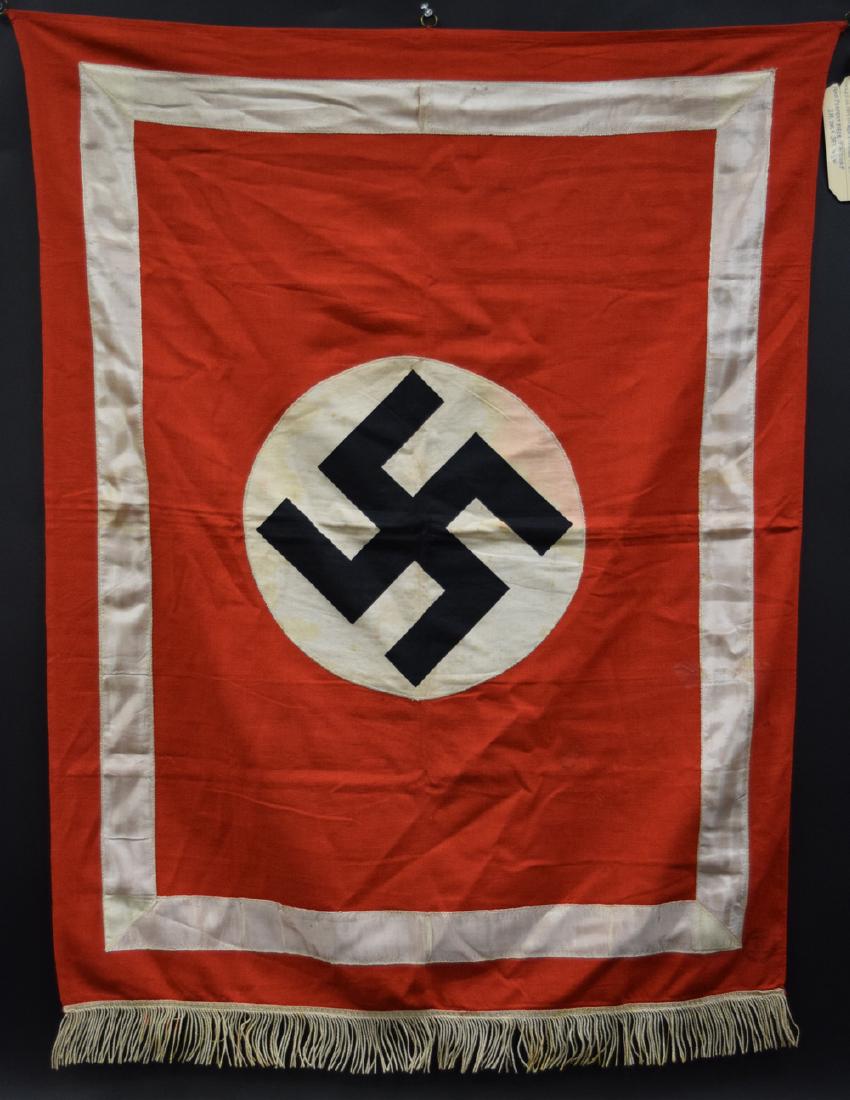 German WWII Podium Banner with Fringes: German WWII Podium Banner with Fringes. 3 small metal rings at the top for pole insertion. Round Swastika Symbol of nearly 2.5" in diameter in bottom front left corner. All designs are stitched. Desig