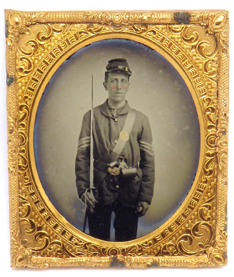 1/6 plate Ruby Ambrotype Image of a Yong Civil War: 1/6 plate Ruby Ambrotype Image of a Yong Civil War Soldier Armed with a Sword & Pistol