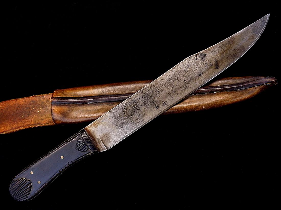 Early 1800s Large Guard-less Bowie Knife, English or: Early 1800s Large Guard-less Bowie Knife, English or AmericanCirca 1830-1840s type, a large Guard-less bowie of most likely English manufacture, unmarked, with carved ebony grips, powerful clip point