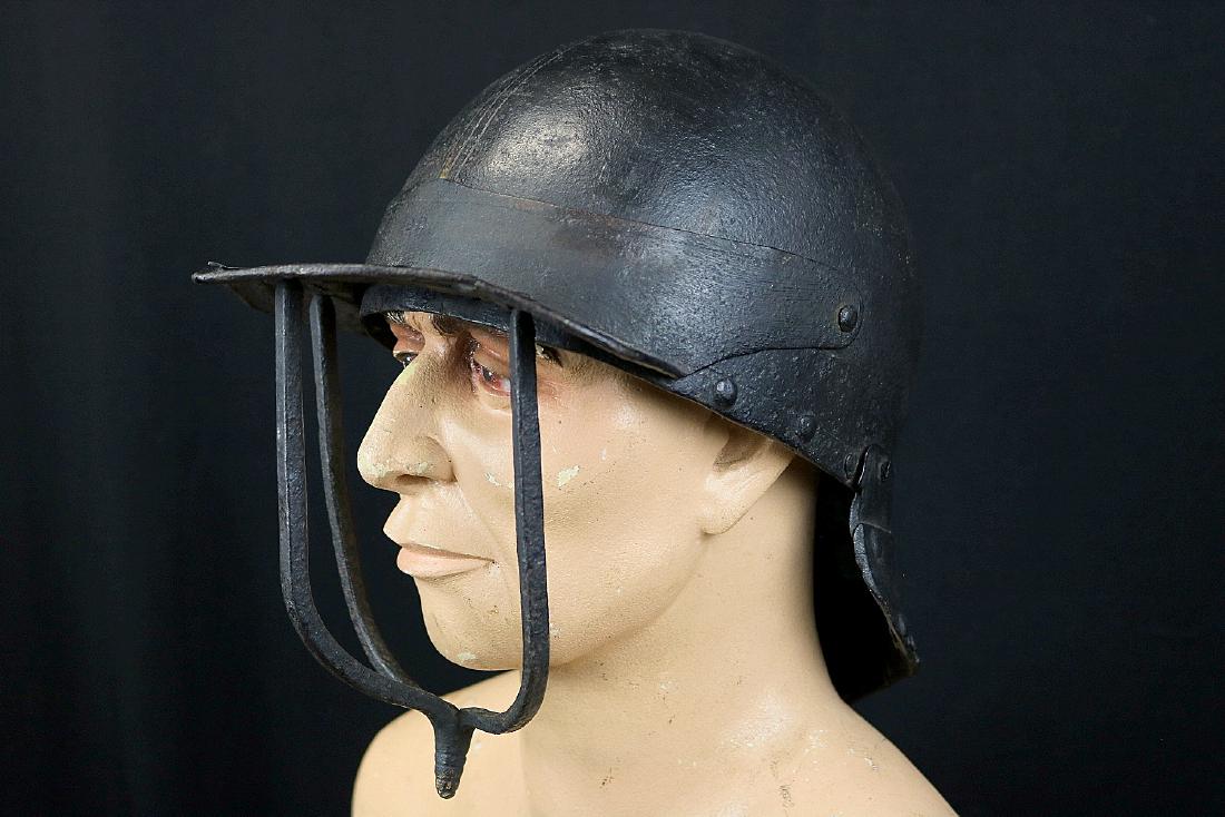 Circa 1650s Cromwellian English Civil War Trooper's: Circa 1650s Cromwellian English Civil War Trooper's Burgonet Helmet. A good early example forged of heavy strong steel with two-piece skull and hinged visor having a suspended three-bars face shield.