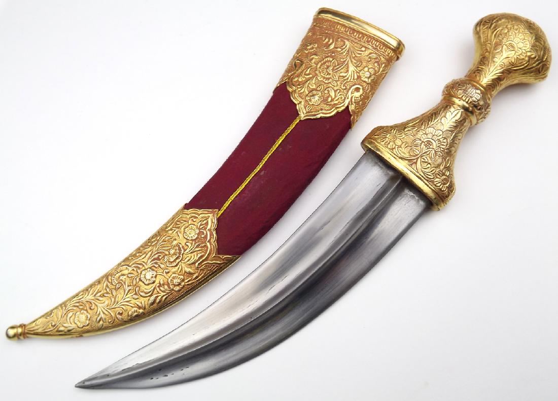 19th C. Islamic Arabic Jambiya Dagger in Richly Gold: 19th C. Islamic Arabic Jambiya Dagger in Richly Gold Gilt Mounts. Overall length: 15 1/2". Blade length: 8 1/2"