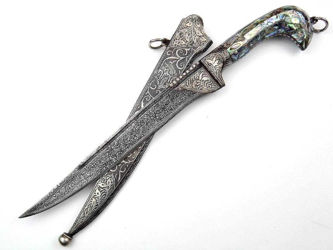 Very Attractive 20th C. Islamic Indian Presentation: Very Attractive 20th C. Islamic Indian Presentation Dagger with Damascus Blade, Nice Silver Koftgari Work and Gorgeous Abalone Shell Grip. Overall length: 14 1/2". Blade length: 9"