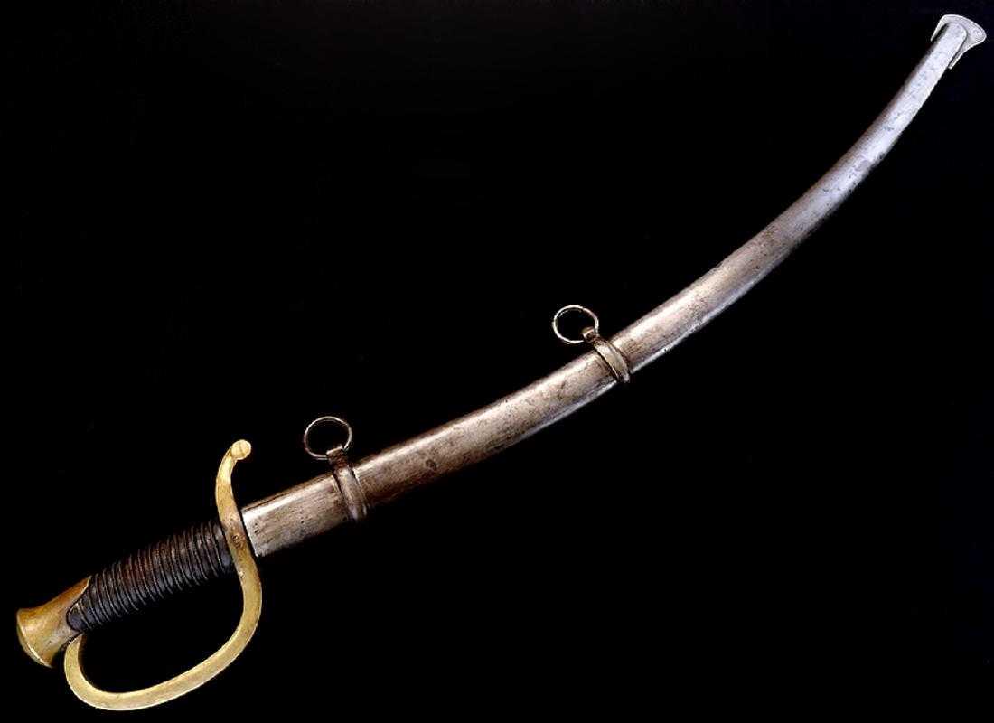 Scarce 1862 US "Connecticut" marked Civil War Artillery: Very nice clean example of the Civil War era US Artillery saber, with its curved large fullered blade marked to the Ames Manufacturer on one side of ricasso, the other side with struck CONN. and early