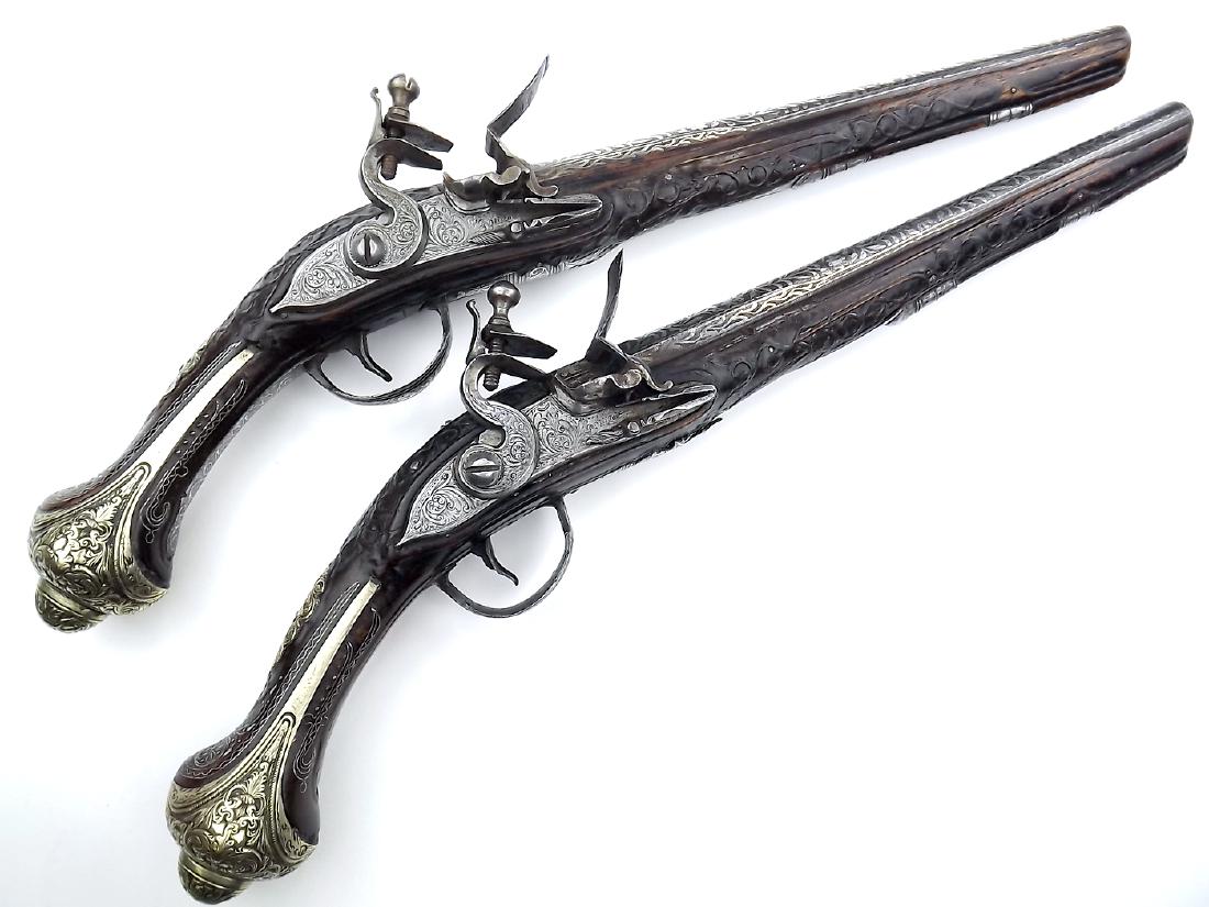 Very Fine Pair of 18th-19th C. Ottoman Turkish: Very Fine Pair of 18th-19th C. Ottoman Turkish Flintlock Pistols in Silver Mounts. Exceptionally attractive large guns with elaborate silver mounts and extensive silver Koftgari works to barrels, trig