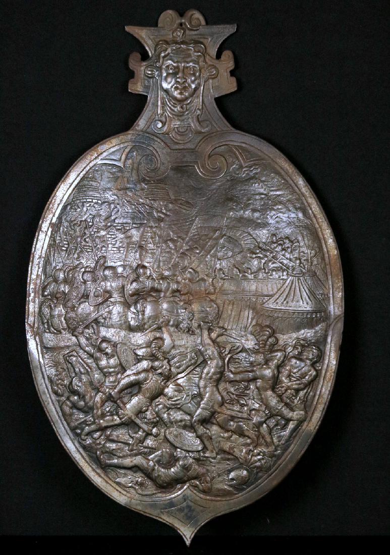 1726 Dated Cast Iron Wall Plaque Shield with Violent: 1726 Dated Cast Iron Wall Plaque Shield with Violent Medieval Battle Scenes. An attractive decorative shield of cast iron depicting a very detailed and very violent battle scene of medieval warriors w