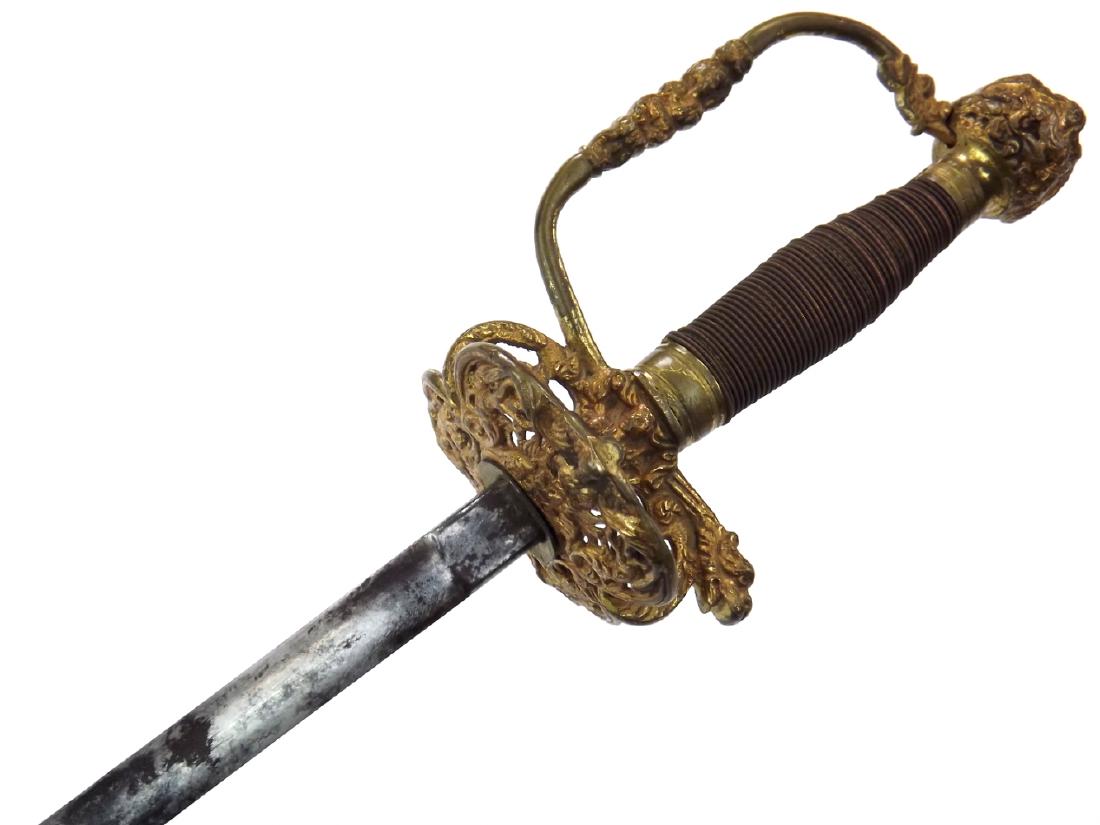 18th C. French or Spanish Small Sword Rapier with an: 18th C. French or Spanish Small Sword Rapier with an Elaborate Gold Gilt Hilt. Lovely 18th C. example with a richly gilt brass hilt showing elaborate pierced details. Elegant grip wrapped in finely br