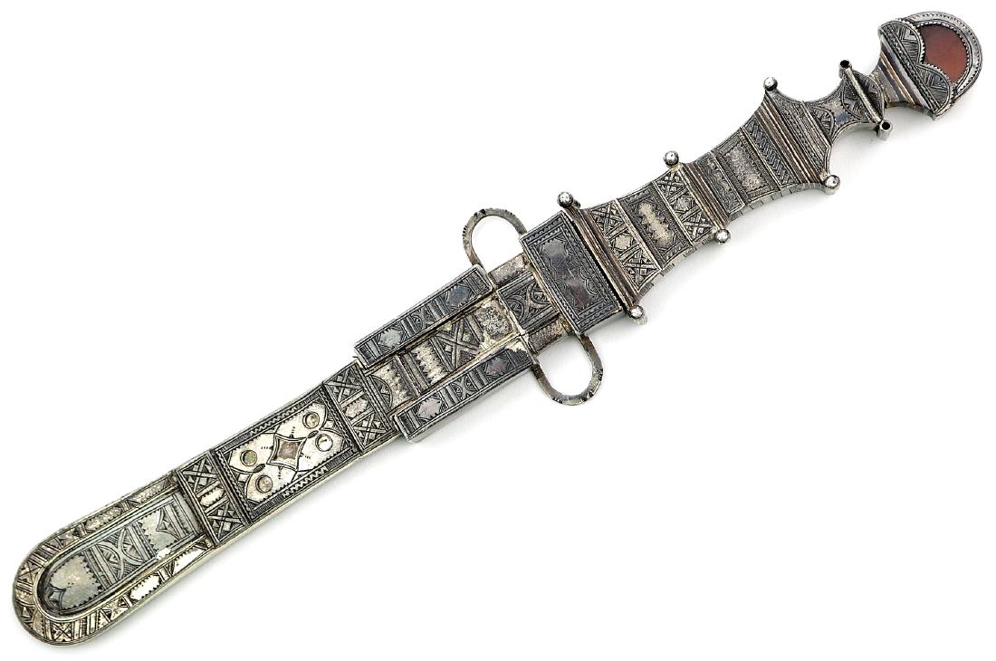 Very Fine 19th C. African TUAREG People Silver Mounted: Very Fine 19th C. African TUAREG People Silver Mounted Chief's Dagger with Carnelian Stone in Pommel. Total length (inside scabbard if present) : 10 1/2", Blade length : 6". Dear Bidders, please note,