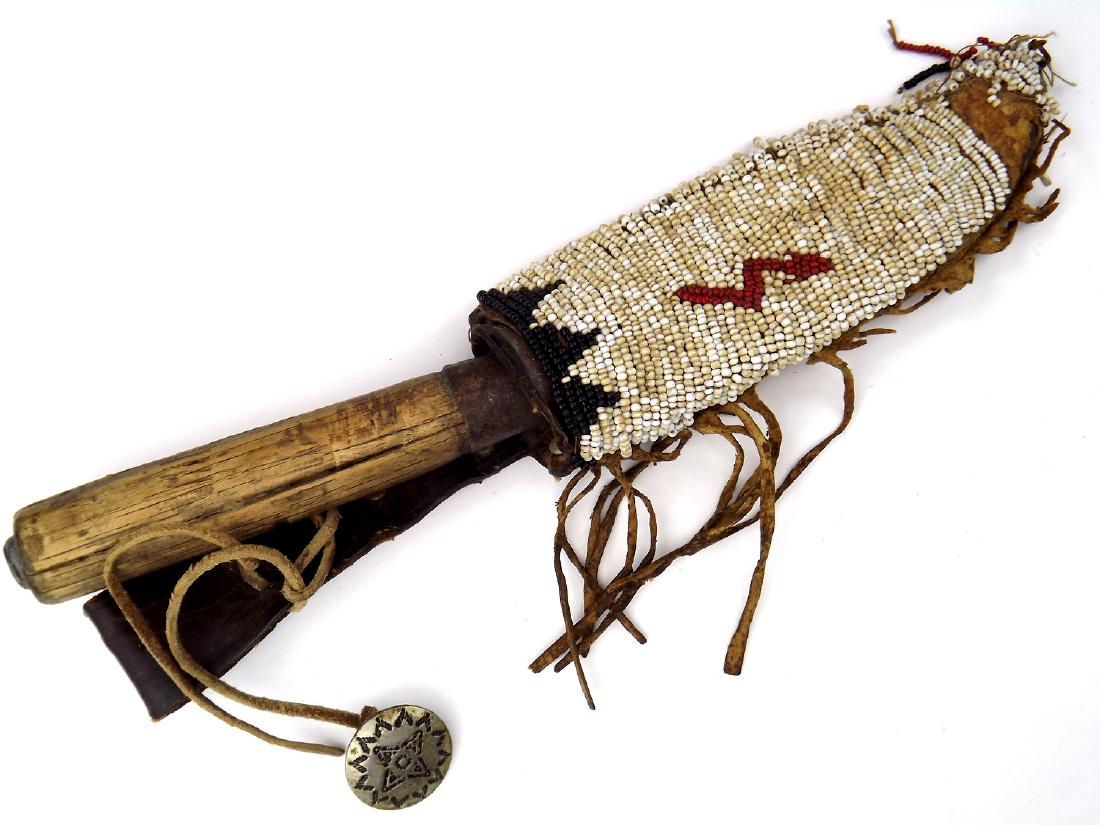 19th C. Native American Indian Used Knife Dagger with: 19th C. Native American Indian Used Knife Dagger with Bead Work Decorated Sheath. With an exceptionally strong and sturdy blade and wooden handle, having a large iron ferrule and lead filled pommel. I