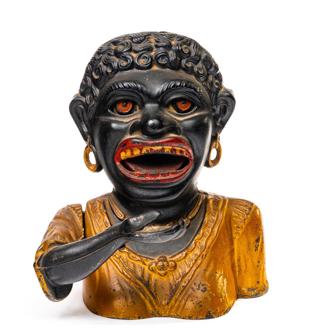 Dinah Mechanical Bank American Cast Iron: Dinah Mechanical Bank American Cast Iron. Produced by John Harper Willenhall, England â€“ Circa 1911 Material: Cast Iron. Place a coin in Dinahâ€™s hand and press the lever, she raises her h