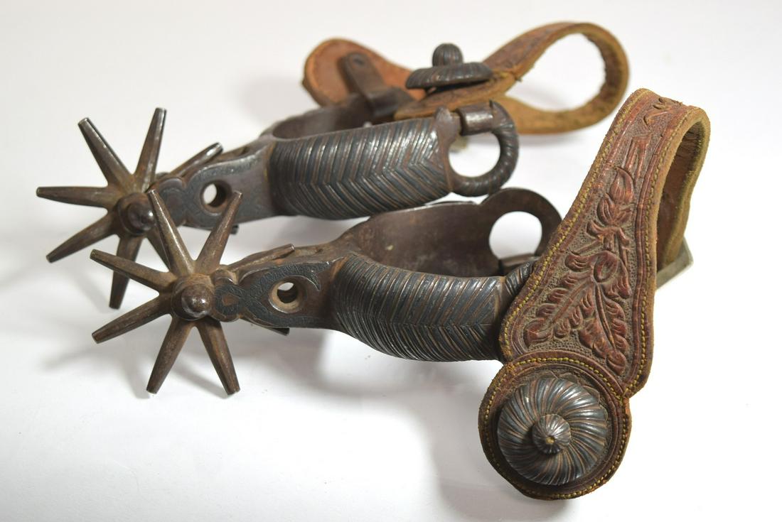 Pair old Western silver inlay decoration spurs with: Fine old pair of Western spurs with silver inlay. Hand tooled leather straps. PROVENANCE - Robert (Bob) N. Green began collecting in the NYC area inn the 1950s. Originally he ran ads in the Shotgun Ne