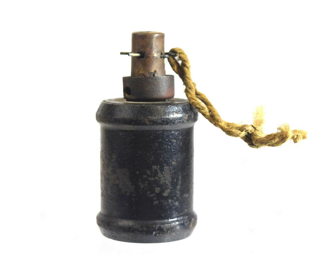 Japanese Type 99 Hand Grenade: Japanese type 99 hand grenade, 3 1/2" x 1 1/2" dia., an improved version of the standard Type 97, modified to resolve issues with the fuse mechanism, and intended to be compatible with the Type 100 gr