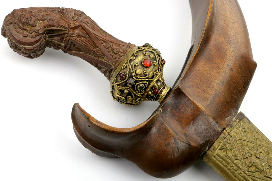 A Beautiful 19th C. Indonesian Malaysian KRIS Dagger: A Beautiful 19th C. Indonesian Malaysian KRIS Dagger with Jeweled and Well Carved Grip, Damascus Blade. Total Length (inside scabbard if present) : 19 1/2", Blade Length : 12"