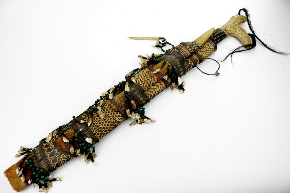 A Very Large Indonesian Borneo Dayak Tribe Head: A Very Large Indonesian Borneo Dayak Tribe Head Hunter's MANDAU Sword with Hair & Teeth Decorations. Total Length (inside scabbard if present) : 36", Blade Length : 26"