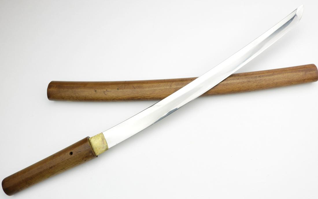 Japanese Samurai Wakizashi Sword Dagger in Old: Probably Koto to Shinto era Japanese Samurai Wakizashi Sword Dagger in Old Shira-Saya Case, Tang is overpolished but Well Signed by the Maker. Total Length in Scabbard - 23 1/4", Blade Length (along t