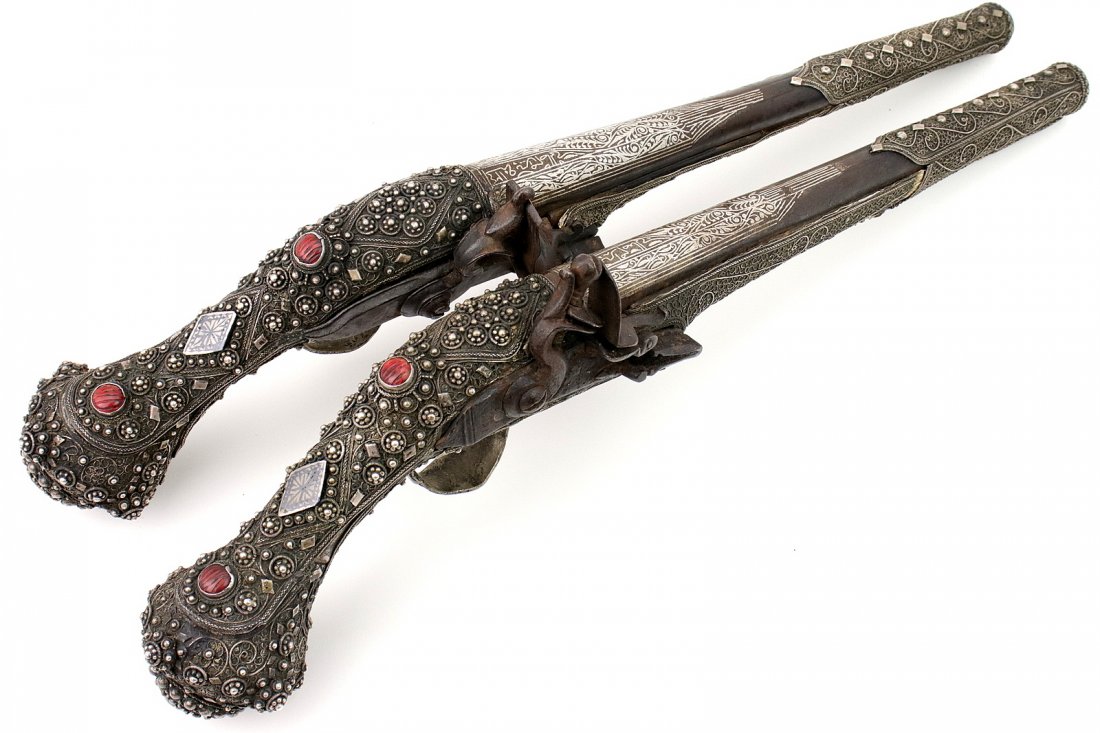 Very Attractive Pair of Ottoman Empire Turkish Pistols: Very Attractive Pair of Ottoman Empire Turkish Pistols in Heavy Filigree Silver mounts. Barrels are silver inlaid with Islamic scripts and struck markings. Beautiful pair with extensive workmanship. L