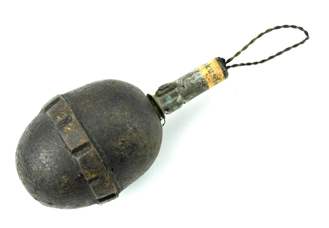 Highly Desirable WWI German Hand Grenades: WWI Model M17 German Egg Grenade (Eierhandgranate) with original sticker Steel Cast body 2 1/4" x 1 3/4".Shows expected oxidation and wear overall, otherwise very good. This example has been deactivat