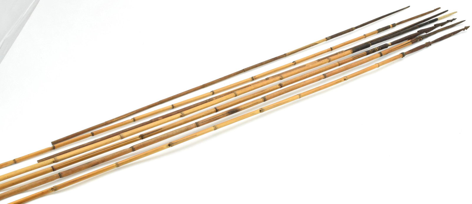 Lot of 7 Indonesian Tribal Hunting & Fishing Spears or: Lot of 7 Tribal Hunting & Fishing Spears, Indonesian or South-East Asian, all with bamboo shafts, some wood and some bone tips. Probably 19th-early 20th century.Longest spear is 62", shortest is 42 1/