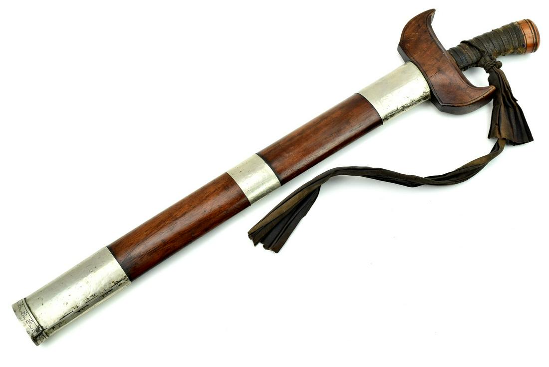 A Good 19th C. Asian Philippine Moro Warrior's KRIS: A Good 19th C. Asian Philippine Moro Warrior's KRIS Sword, with a powerful double edged blade of oval cross-section, featuring chiseled guard details with a heavy silver band, and retaining good sharp