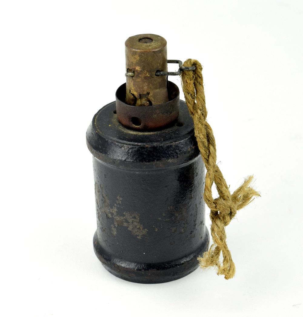 WWII Japanese type 99 hand grenade: Japanese type 99 hand grenade, 3 1/2" x 1 1/2" dia., an improved version of the standard Type 97, modified to resolve issues with the fuse mechanism, and intended to be compatible with the Type 100 gr