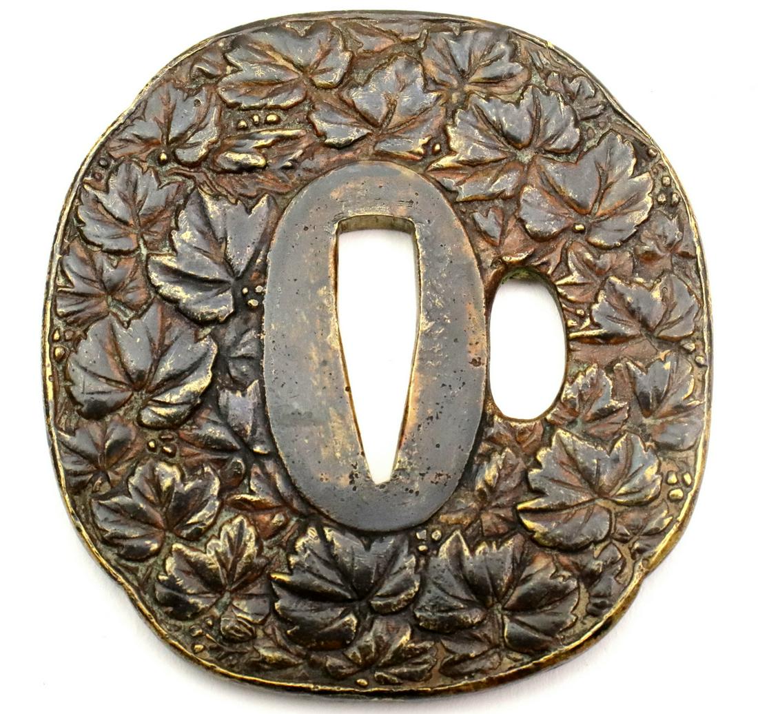 Nice 19th C. Gilt Copper Japanese Samurai Sword Tsuba: Nice 19th C. Gilt Copper Japanese Samurai Sword Tsuba with Foliage ~ Very Thick. Diameter : 2 7/8" x 2 5/8". Detailed condition reports are not included in this catalog. For additional information, in