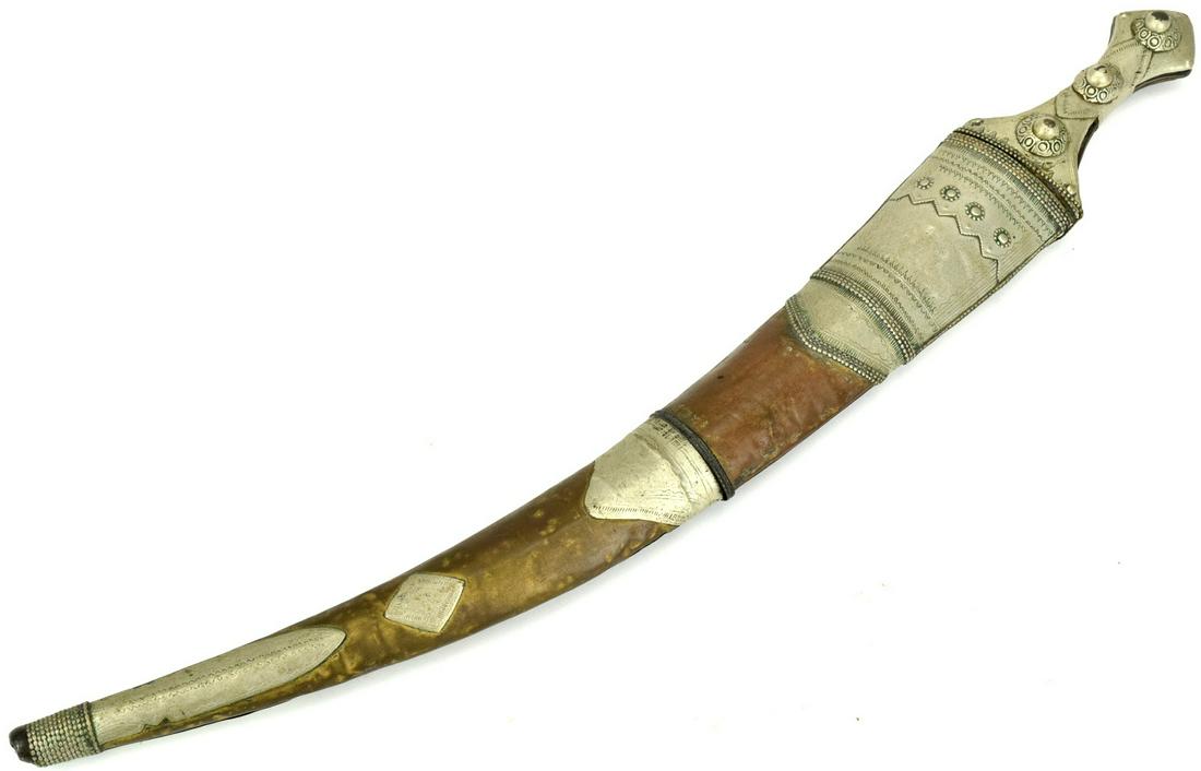 Nicely Mounted Islamic Arabic Wahhabite Jambiya Short: Nicely Mounted Islamic Arabic Wahhabite Jambiya Short Sword Dagger. Curved broad blade with raised medial ridge, characteristic white metal mounted hilt, decorated with panels of foliage, contained in
