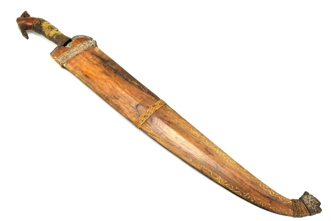 Unusual 19th C. Philippine Moro BARONG Sword Dagger: Unusual 19th C. Philippine Moro BARONG Sword Dagger with Very Long Blade & Nicely Carved Mounts.Total Length (inside scabbard if present) : 28" Blade Length : 20 1/4"Detailed condition reports are not