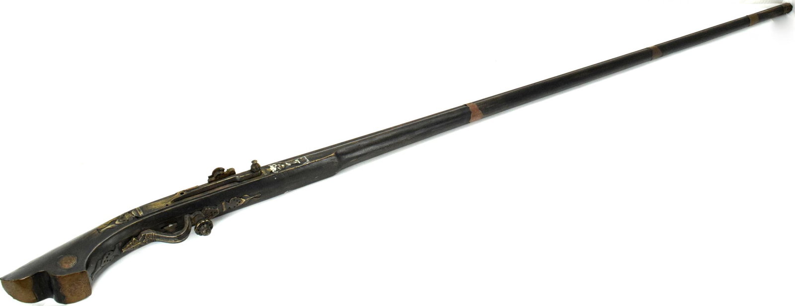 Rare 19th C. Indonesian Malaysian SATINGAR Match-Lock: Rare 19th C. Indonesian Malaysian SATINGAR Match-Lock Long Rifle with Elaborate Bronze Mounts.Total Length : 68 1/4" Detailed condition reports are not included in this catalog. For additional informa
