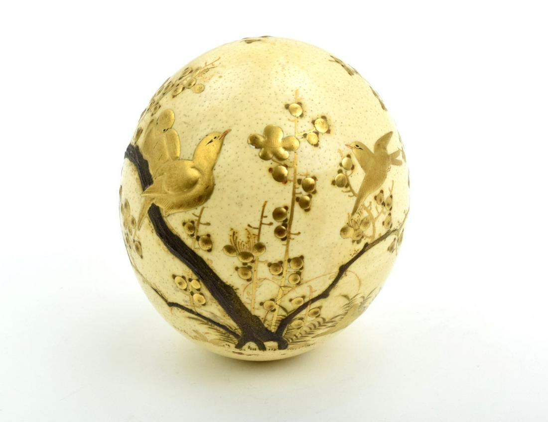 Fine Antique Gold Inlay Japanese Style Ostrich Egg: Meiji period ( 1868 -1912 ) circa: 1900 Gold lacquer Ostrich egg. Egg extensively decorated with birds and flowers blossoming trees , in gold takamakie.Unsigned.Length : 5 1/2"
