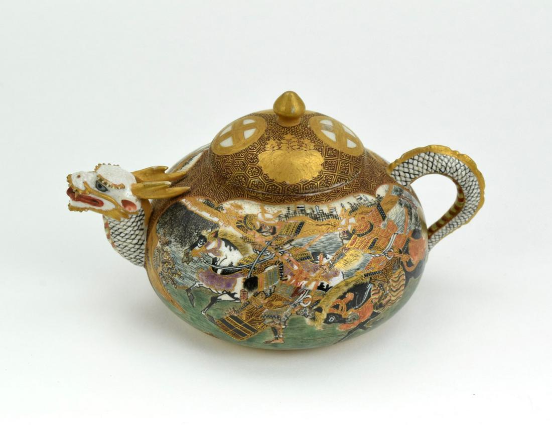 Fine Antique Meiji Japanese Satsuma Dragon Design: Very fine antique Meiji period Japanese Satsuma teapot with dragon design. Highly decorated with scenes of fighting Samurai.Signed on the bottom.Length : 2 1/2" X 5"