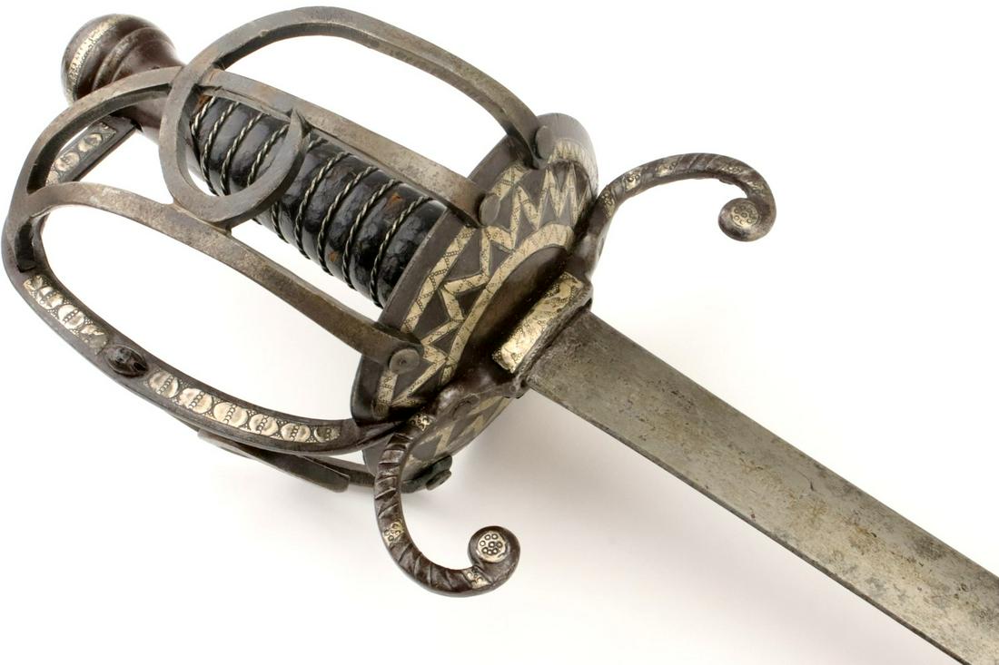 Rare & Fine 18th C. Mexican Officer's Rapier Sword with: Rare & Fine 18th C. Mexican Officer's Rapier Sword with Heavy Silver Inlaid Hilt Decorations. A very fine and seldom encountered example, having elaborate iron hilt mounts profusely decorated with hea