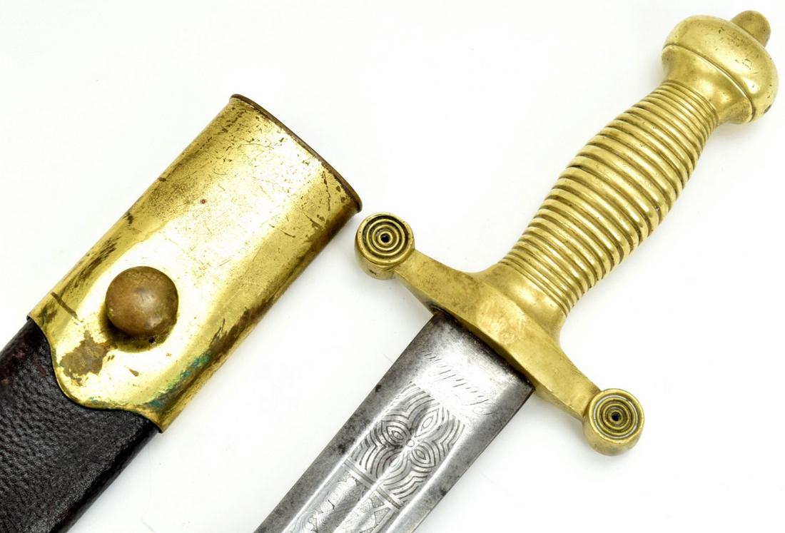 19th Century French Artillery Short Sword with Nice: 19th Century French Artillery Short Sword. Edged with military motif blade marked at ricasso. Brass guard and grip with matching leather and brass mounted scabbard. .Total Length (inside scabbard if p