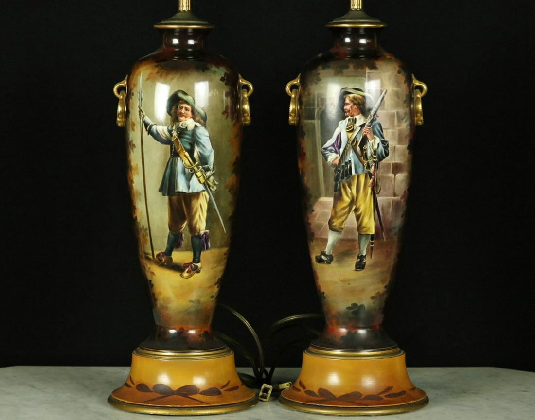 Lovely Pair of Antique German Hand-Painted Porcelain: Lovely Pair of Antique German Hand-Painted Porcelain Lamps Depicting Armed Musketeer Soldiers with Rapier Swords & Musket. Lamps are made of hand-painted vases by the company Royal Bonn in Bonn, Germa