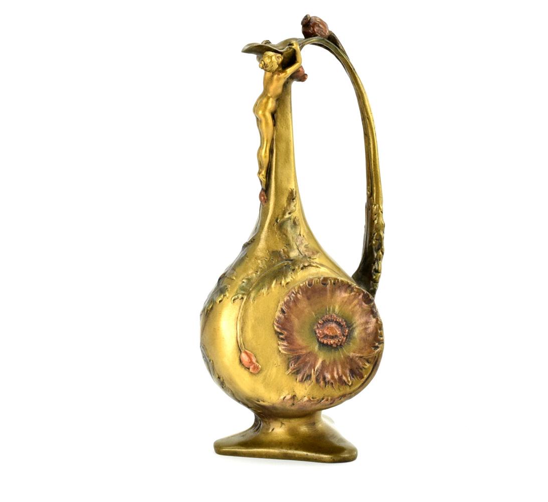 Art Nouveau Bronze Nude Vase By Jules Jouant: Very fine bronze Art Nouveau vase by French sculptor Jules Jounat ( 1882-1921 ).Signed "Jouant" in bronze, depicting a nude nymph sitting atop a spouted vase decorated in relief of poppy seed flowers.